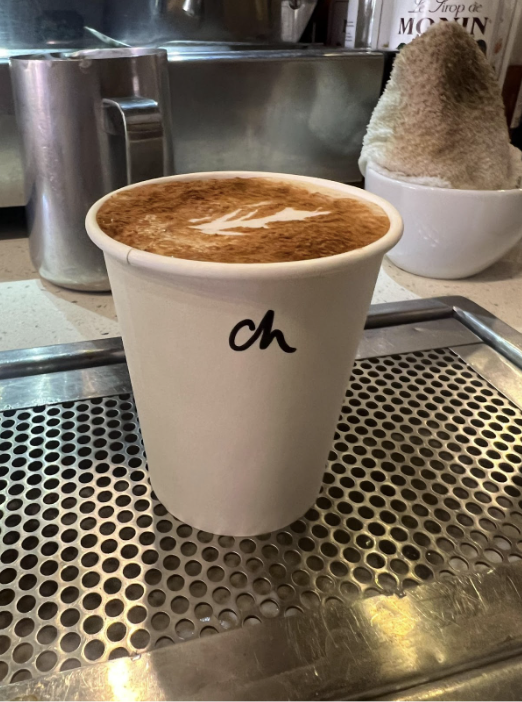 A pumpkin chai latte from Chestnut Hill Coffee, where the author works, waits to be enjoyed.