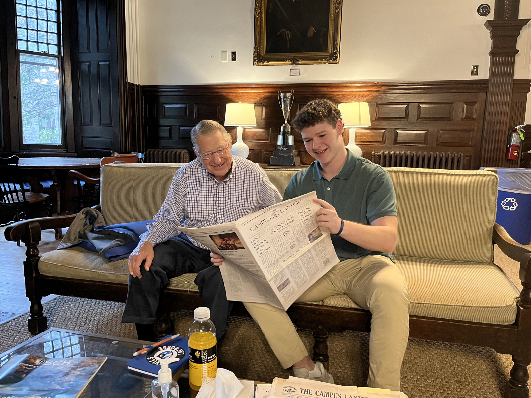 Charles B. Chas Landreth and Griffy Whitman 25 review the most recent print edition of The Lantern. Photo courtesy of Melissa Brown 87