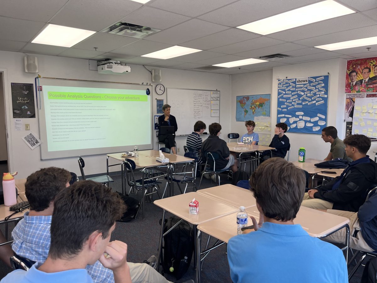 Upper School Students discuss presidential debate in Ms. Mcdowell's room during lunch on Wednesday.