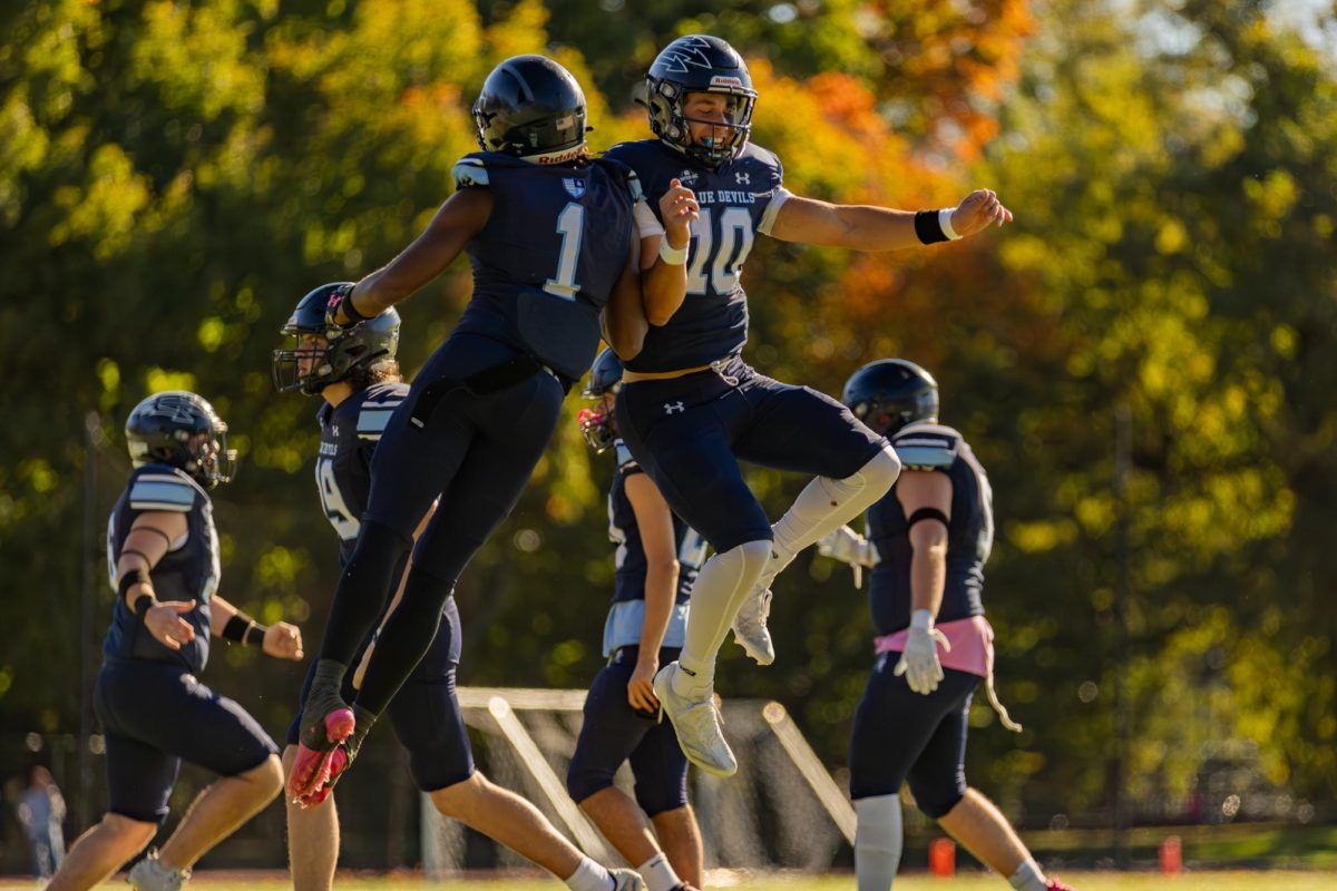 Aaron Clark (left) and Liam Zelman (right) celebrate after a touchdown pass.