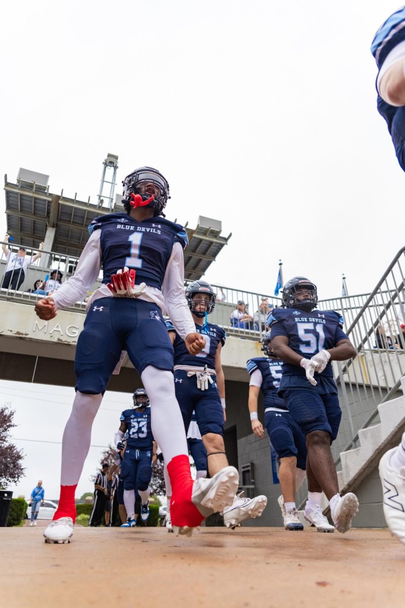 Aaron Clark leads the Devils out of the tunnel. 