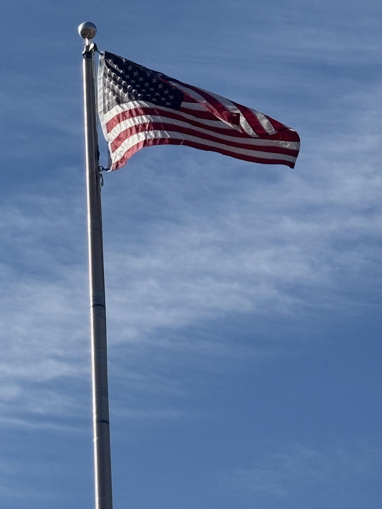 The American flag outside Maguire Stadium flaps in the wind 