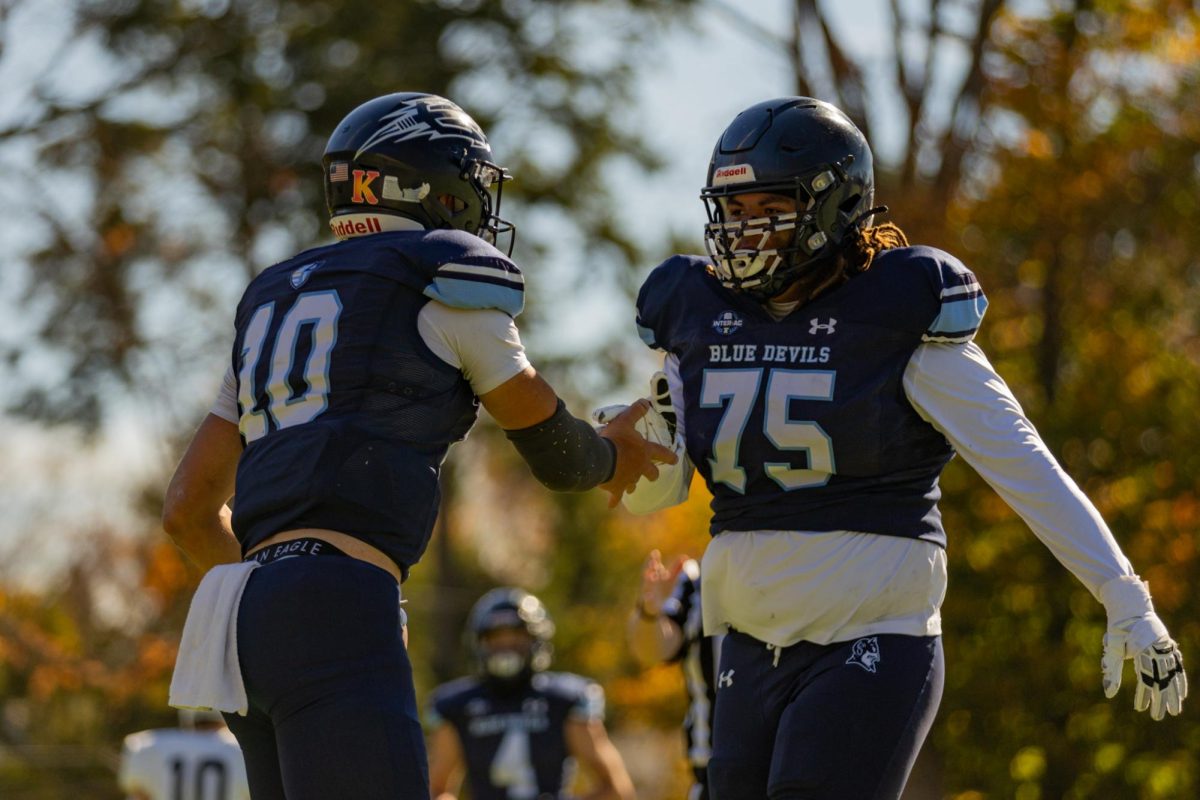 Liam Zelman celebrates with Grayson Scott.