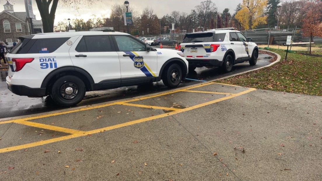 Police cars parked outside of Penn Charter as intense search goes on.