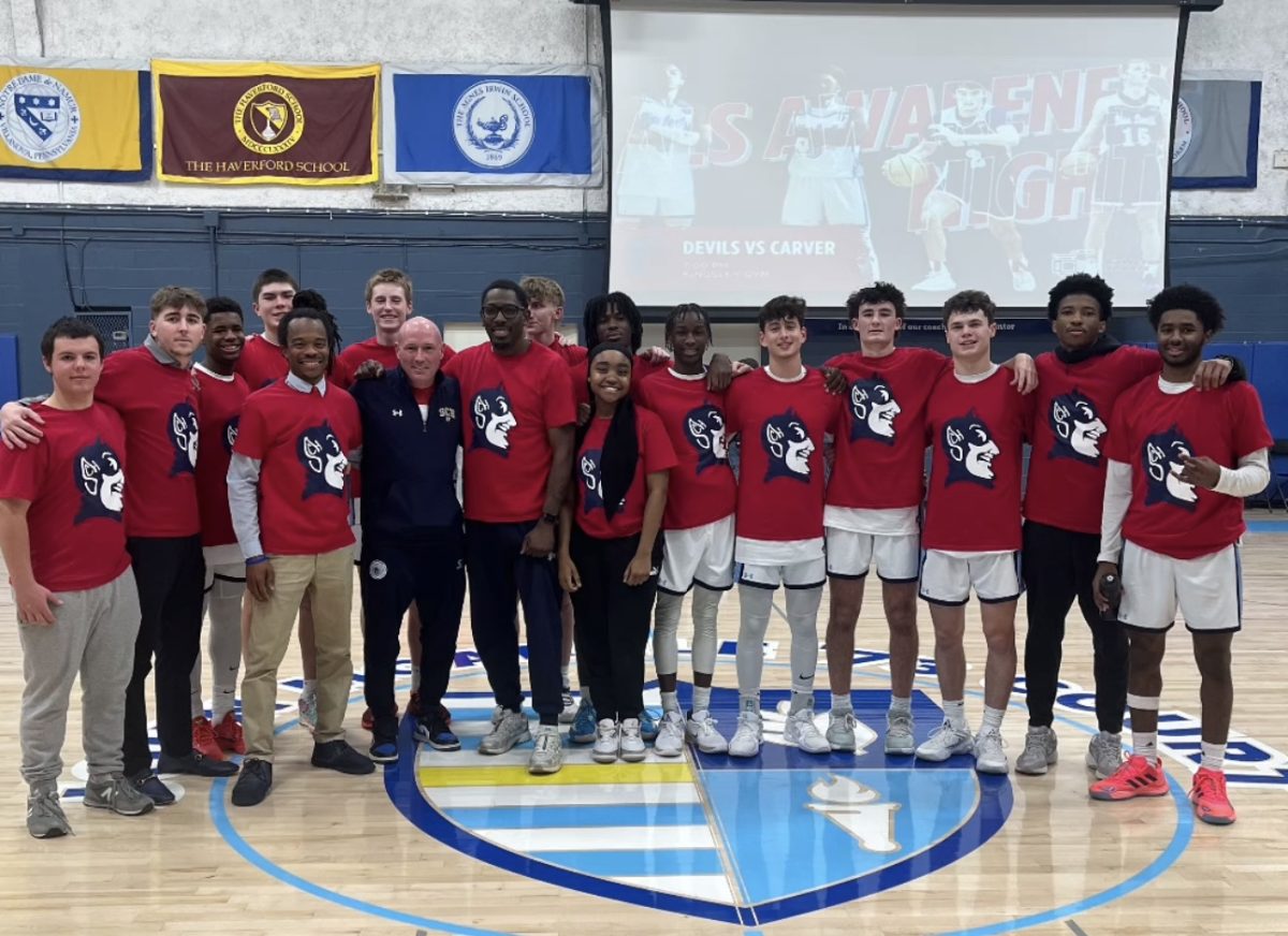 The Devils line up to celebrate their win on ALS night in honor of Coach Brown.