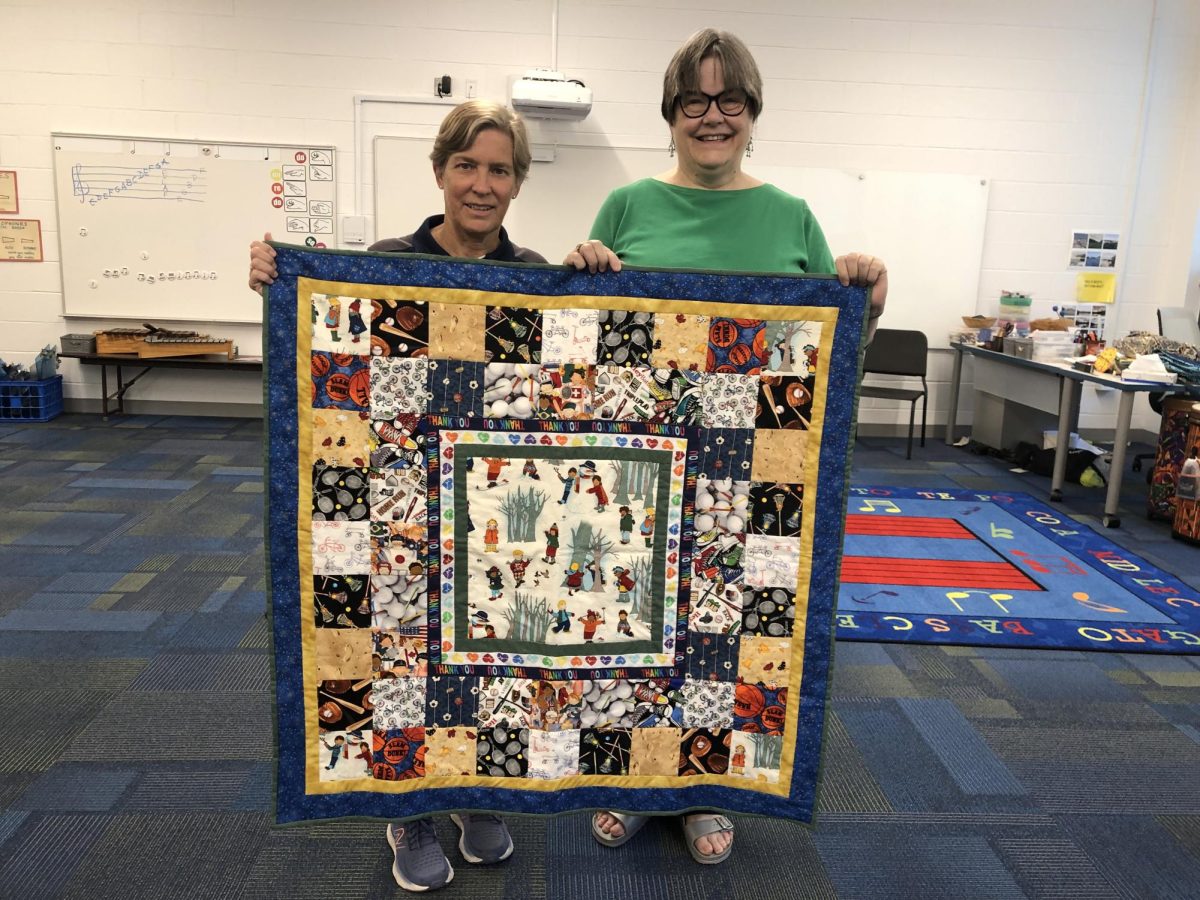 A photo of BA Fish's quilt. She is retired PE department Share.
 