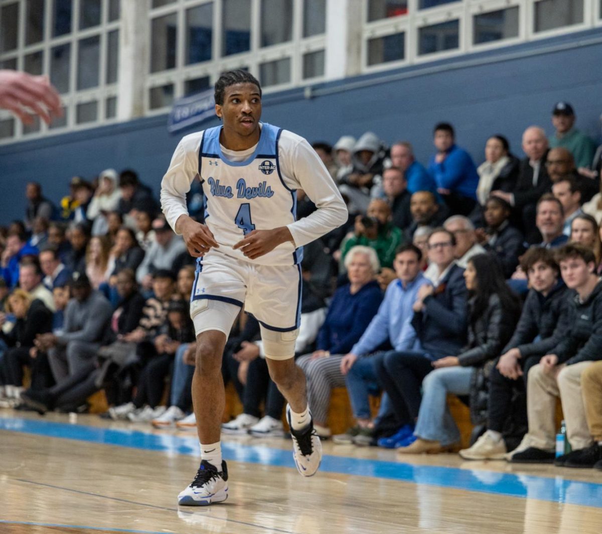 Kam Waters moves after a basket.