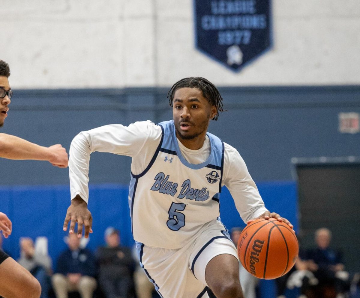 Keni Williams attacks the basket against Penn Charter