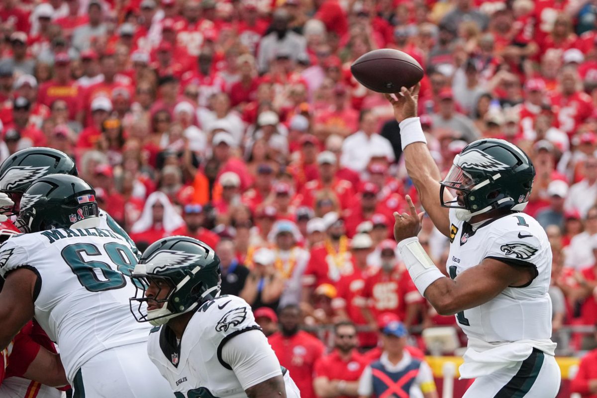Sep 14, 2025; Kansas City, Missouri, USA; Philadelphia Eagles quarterback Jalen Hurts (1) passes the ball against the Kansas City Chiefs during the first quarter of the game at GEHA Field at Arrowhead Stadium. Mandatory Credit: Denny Medley-Imagn Images