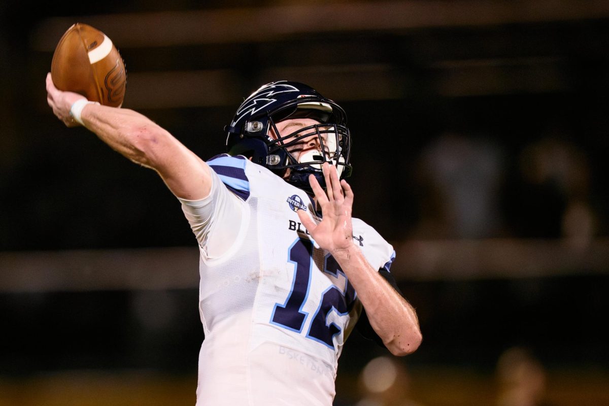 Senior WR Joey Markey tosses a flea-flicker pass for a touchdown.