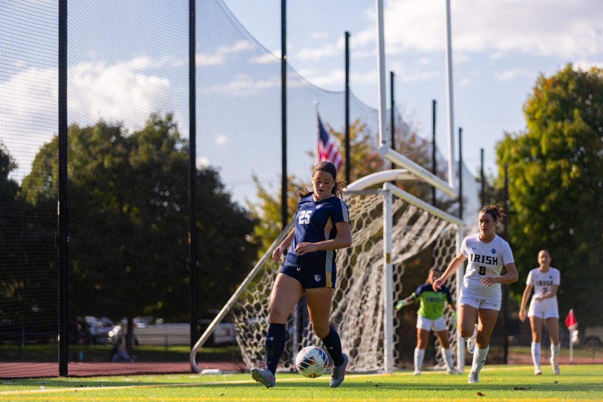 Ryleigh Bakley '27 works with the ball around the net.
