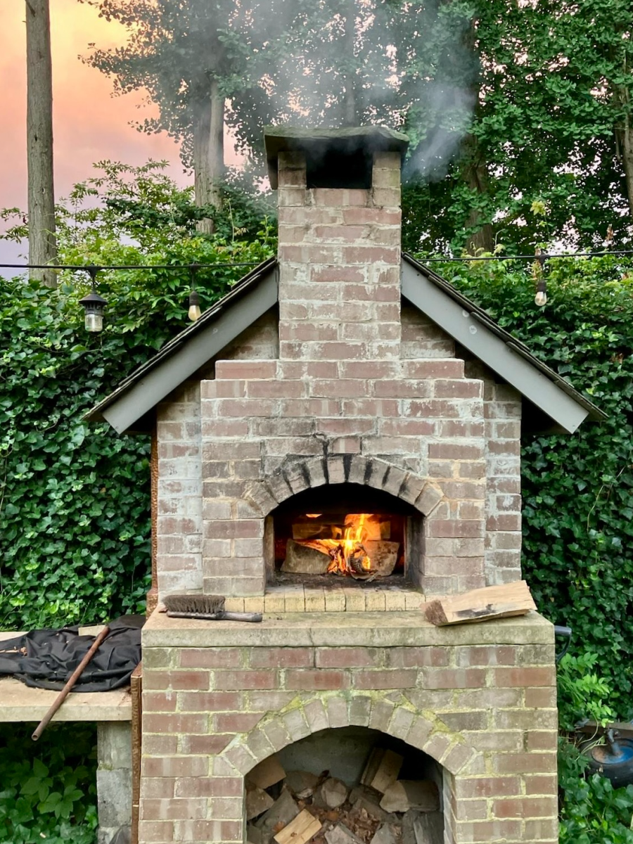 Jennings House Pizza oven with a roaring fire, ready to heat up pizza