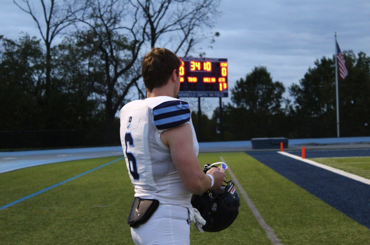 Colin McFadden stands on the sidelines. 