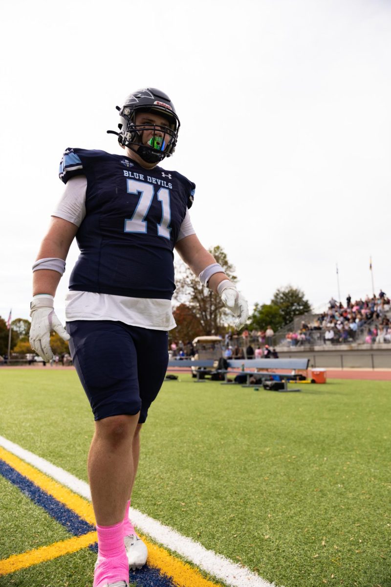 Kyle Cameron stands on the field.