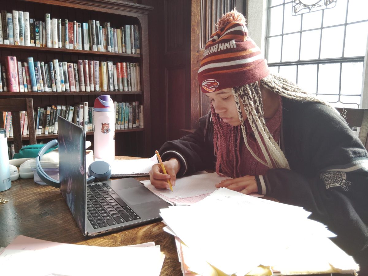 Florence Ajunwa in the 1st book cubby of the Henry Library