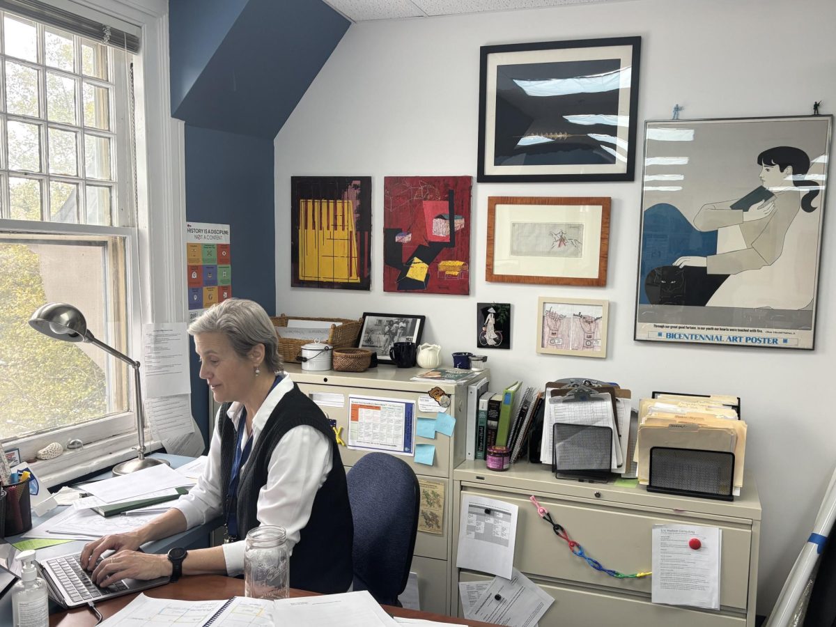 Mrs. McDowell sits at her desk working 